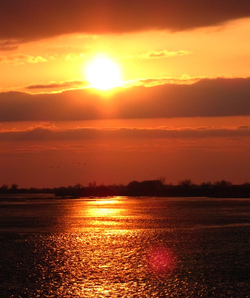 Evening Sun Breaks From Clouds Over the Platte River