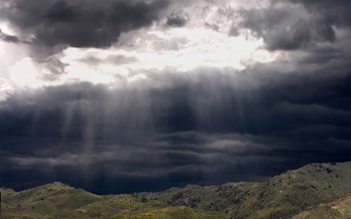 Streaming Light over Rolling Hills