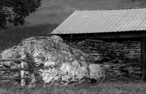Granite Boulder, Fence, and Wood Shed on Pennington County Road 233 (black and white)